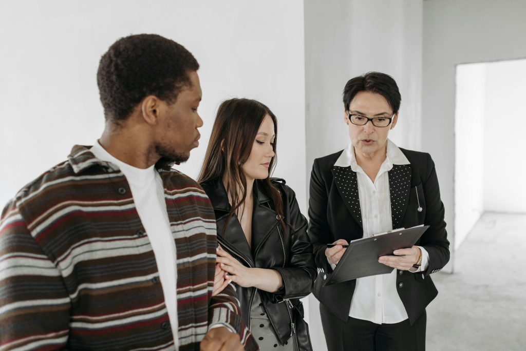 Buyer reviewing a home inspection report with realtor